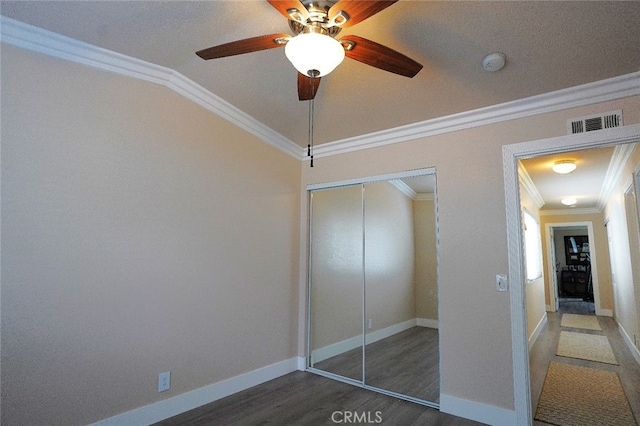 30266 Via Reata, Laguna Niguel, CA 92677 - unfurnished bedroom featuring ornamental molding, wood finished floors, a closet, baseboards, and ceiling fan