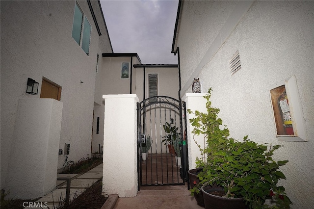 30266 Via Reata, Laguna Niguel, CA 92677 - doorway to property featuring a gate and stucco siding