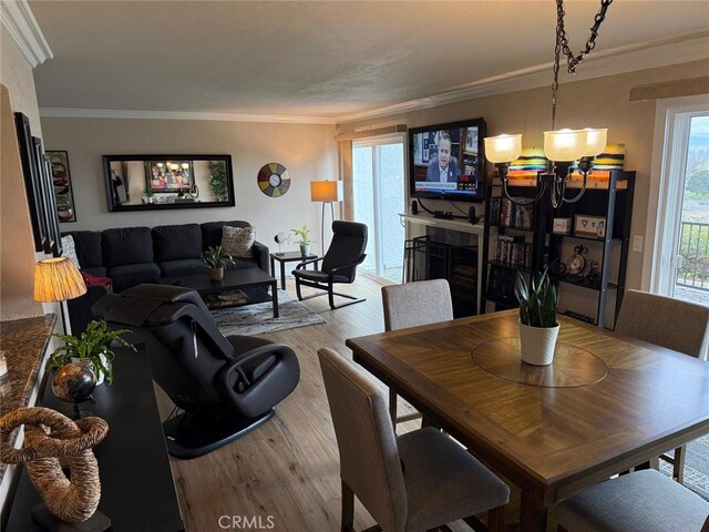 30266 Via Reata, Laguna Niguel, CA 92677 - dining area with wood finished floors, ornamental molding, and a chandelier