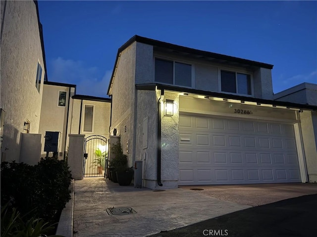 30266 Via Reata, Laguna Niguel, CA 92677 - view of property featuring stucco siding and a garage