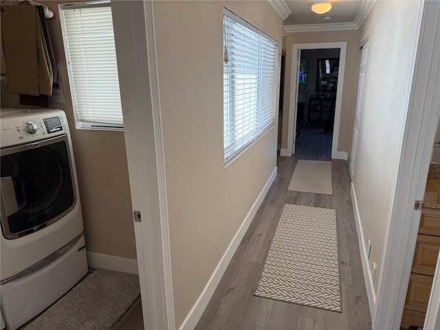 30266 Via Reata, Laguna Niguel, CA 92677 - clothes washing area with washer / clothes dryer, crown molding, wood finished floors, cabinet space, and baseboards