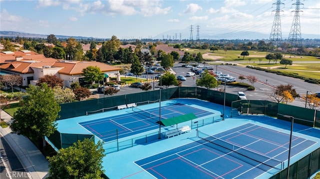 view of tennis court with fence