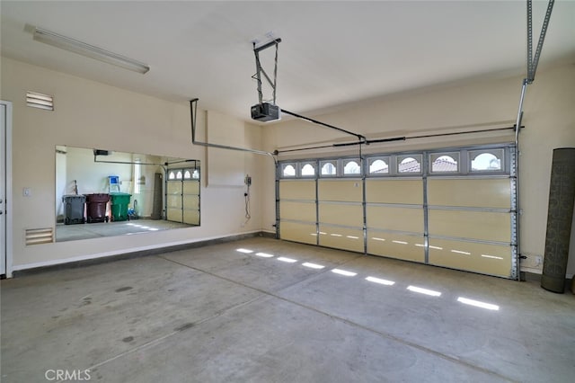 garage featuring baseboards and a garage door opener