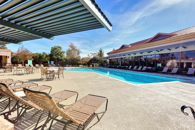 pool featuring a patio and fence