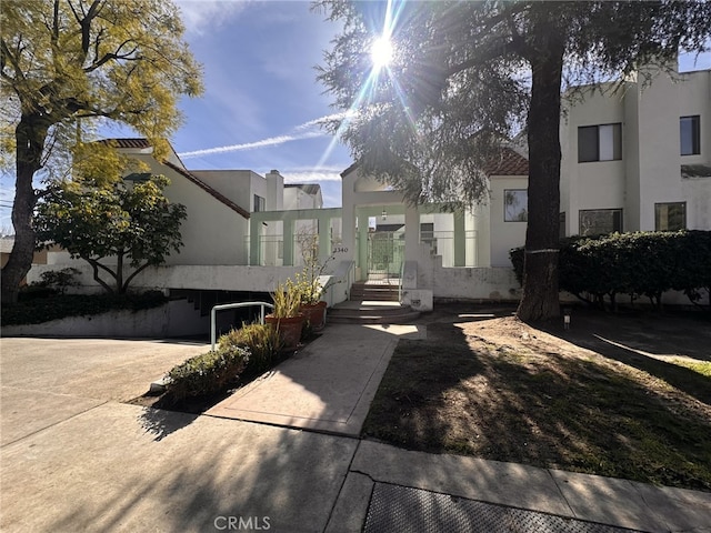 view of front of house featuring stucco siding