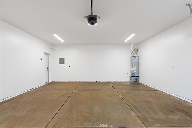 garage featuring strapped water heater and electric panel