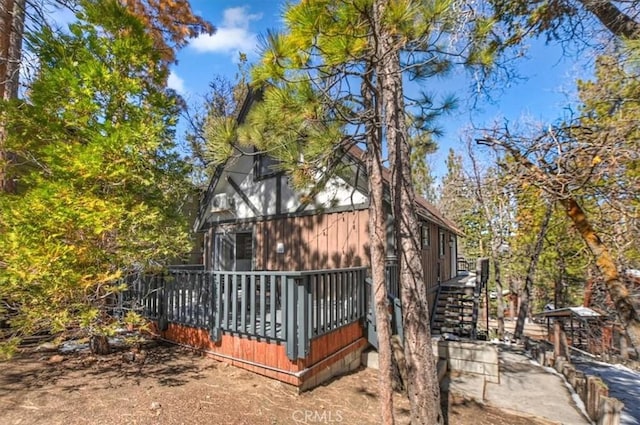 back of house with a wooden deck