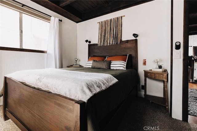 bedroom featuring beam ceiling