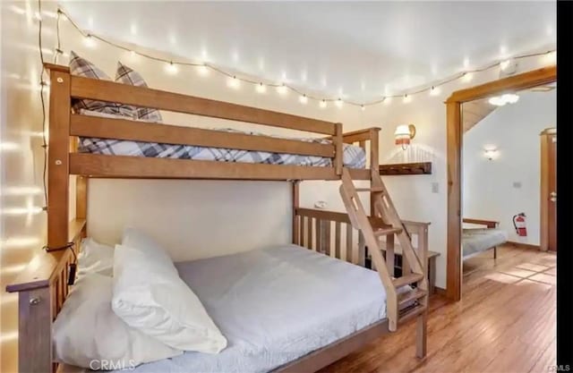 bedroom featuring wood finished floors