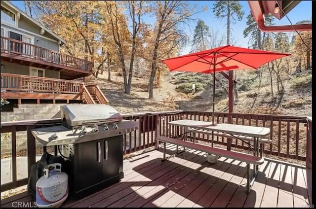 wooden deck featuring grilling area and stairs