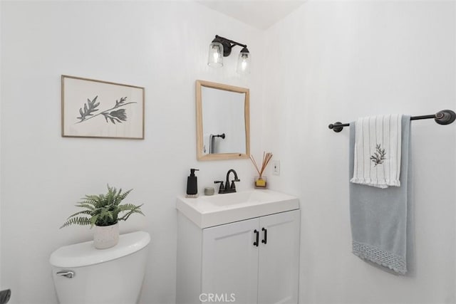 bathroom with toilet and vanity