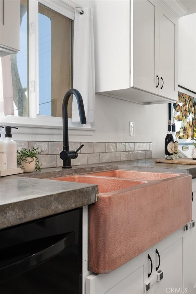 interior space featuring wine cooler and white cabinetry