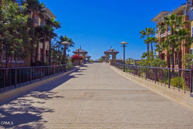 surrounding community with fence and a gazebo