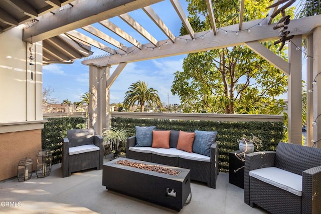 view of patio / terrace featuring a pergola and an outdoor living space with a fire pit