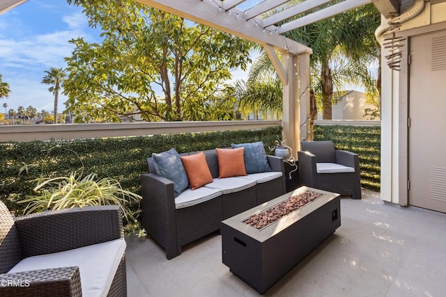 view of patio with a pergola and an outdoor living space with a fire pit