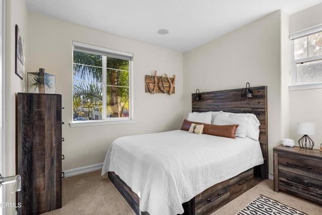 bedroom featuring carpet floors and baseboards