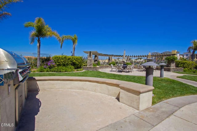 surrounding community featuring a patio area and a yard