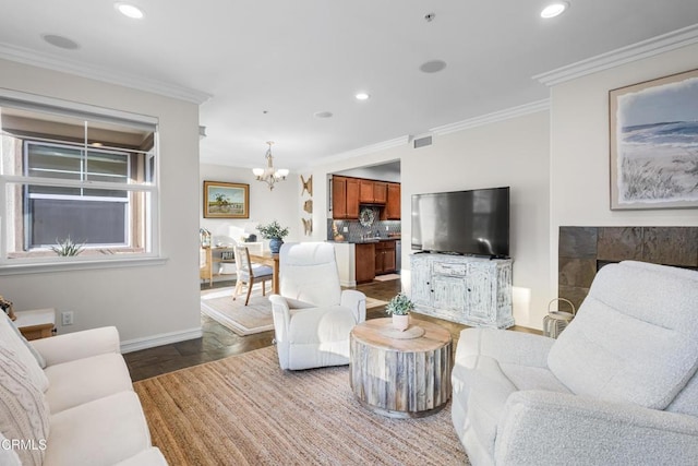 living room with a chandelier, recessed lighting, wood finished floors, baseboards, and ornamental molding