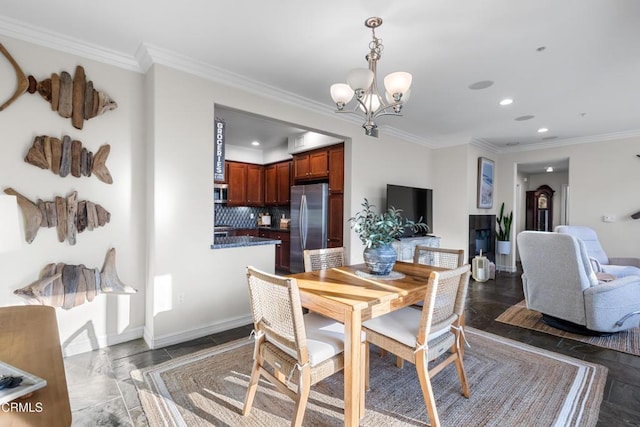 dining space featuring baseboards, ornamental molding, recessed lighting, and an inviting chandelier