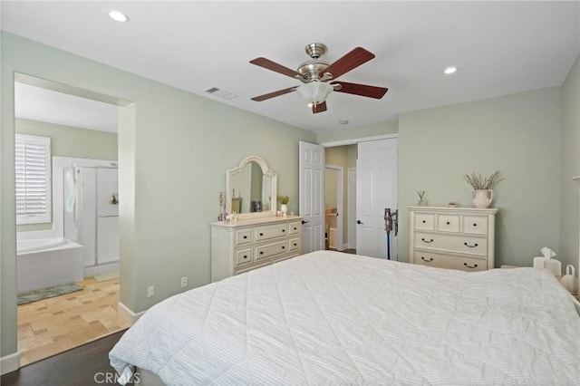 bedroom featuring visible vents, ceiling fan, recessed lighting, wood finished floors, and ensuite bath