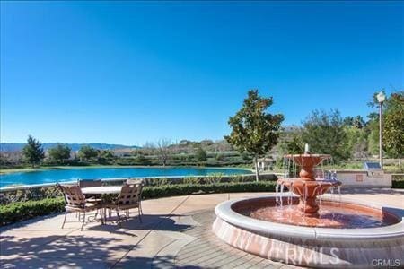 view of patio / terrace featuring a water view