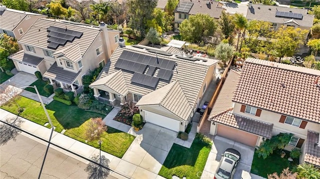 birds eye view of property with a residential view