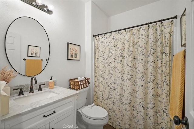 full bath featuring curtained shower, toilet, and vanity