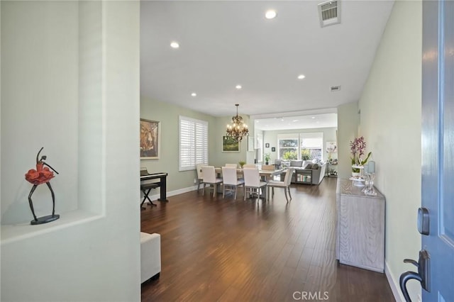 dining space with visible vents, baseboards, an inviting chandelier, recessed lighting, and dark wood-style flooring