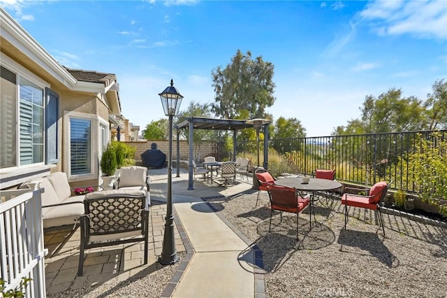 view of patio / terrace featuring outdoor dining space, an outdoor living space, and a fenced backyard