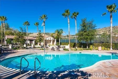 community pool with a patio