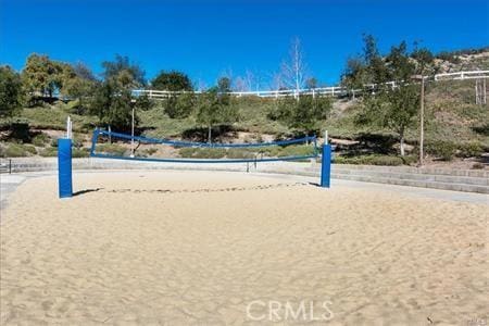 view of home's community featuring volleyball court