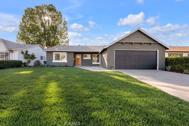 ranch-style home featuring a garage, a front lawn, driveway, and stucco siding