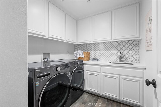 106 Via Sabinas, San Clemente, CA 92673 - clothes washing area with separate washer and dryer, cabinet space, and dark wood-style flooring
