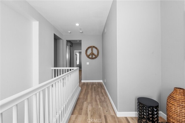106 Via Sabinas, San Clemente, CA 92673 - hall featuring light wood-type flooring, recessed lighting, baseboards, and an upstairs landing