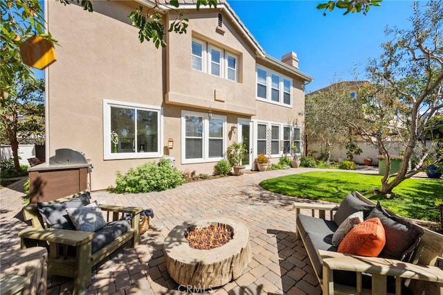 106 Via Sabinas, San Clemente, CA 92673 - back of house featuring a patio area, stucco siding, a chimney, exterior kitchen, and an outdoor living space with a fire pit