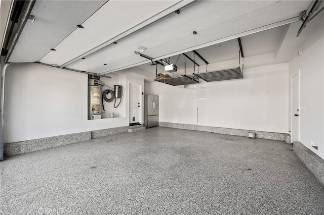 106 Via Sabinas, San Clemente, CA 92673 - garage featuring water heater, washer / clothes dryer, a garage door opener, and baseboards