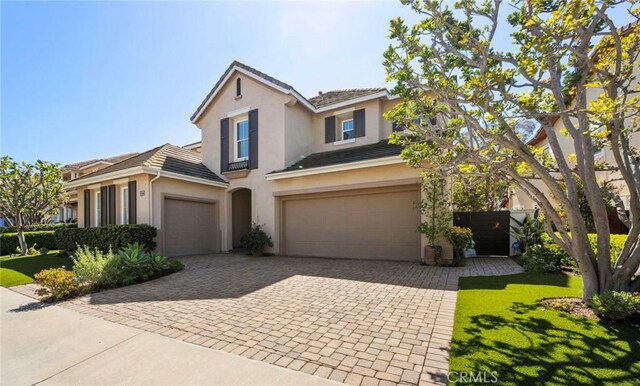 106 Via Sabinas, San Clemente, CA 92673 - traditional home featuring stucco siding, a garage, decorative driveway, a tiled roof, and a front yard