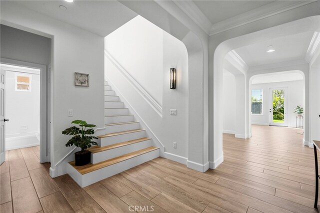 106 Via Sabinas, San Clemente, CA 92673 - stairs with wood finished floors, crown molding, arched walkways, baseboards, and recessed lighting