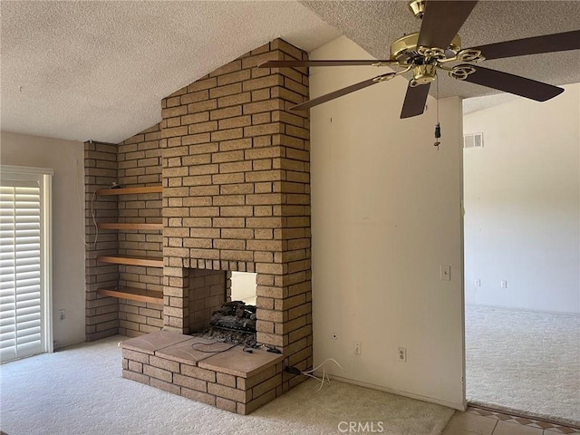 unfurnished living room featuring carpet floors, a fireplace, a textured ceiling, and lofted ceiling