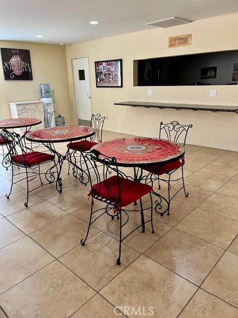 dining space featuring recessed lighting, visible vents, baseboards, and light tile patterned floors