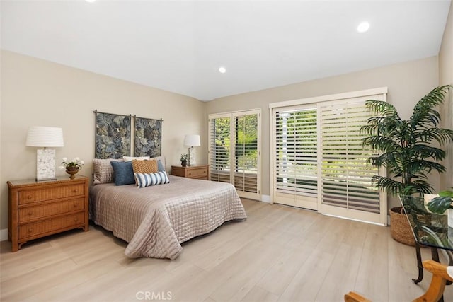 bedroom with vaulted ceiling, access to outside, recessed lighting, and light wood-type flooring