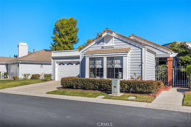 view of front of property with a garage and driveway