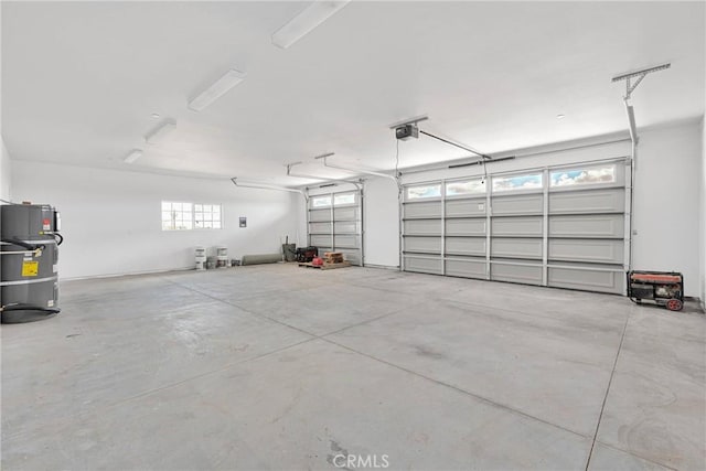 garage featuring secured water heater and a garage door opener