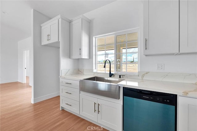 kitchen featuring a sink, white cabinets, light wood-type flooring, light stone countertops, and dishwasher