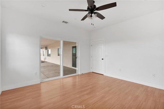 unfurnished bedroom featuring ceiling fan, light wood finished floors, visible vents, and baseboards