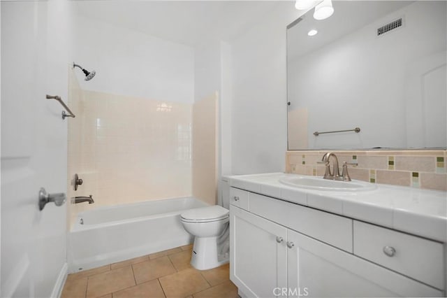 full bath featuring tile patterned floors, visible vents, toilet, washtub / shower combination, and vanity