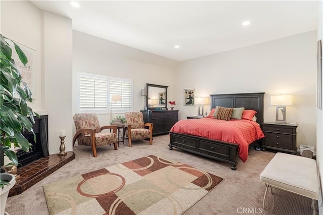 bedroom featuring light carpet and recessed lighting