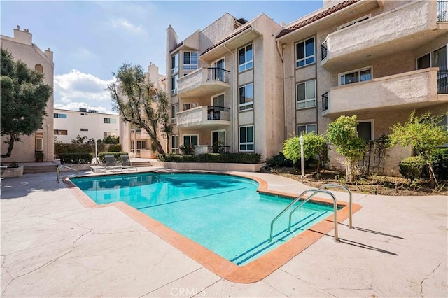 pool with a patio