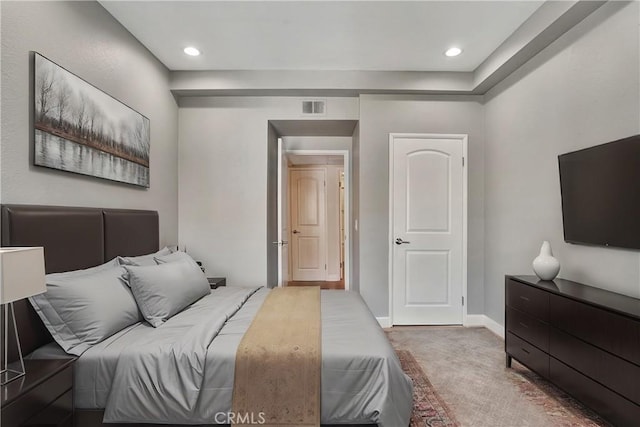 carpeted bedroom with baseboards, visible vents, and recessed lighting