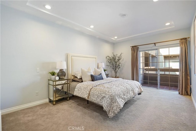 carpeted bedroom featuring baseboards and recessed lighting